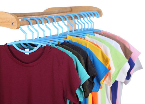 t-shirts hanging on hangers