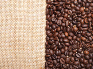 Fototapeta premium Coffee beans on burlap background