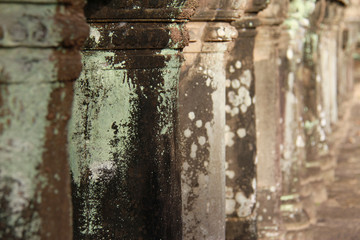 close up of ancient stone pillars at Angkor Wat