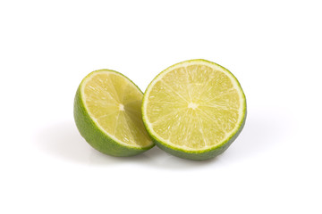 Two halfs of citrus lime on the white background.