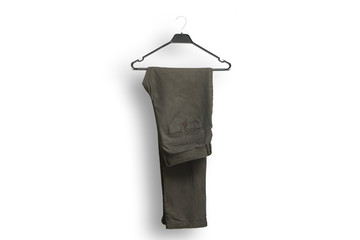 Stylish men's grey pants on a hanger on white background