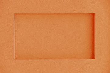 Orange rectangular niche in concrete wall
