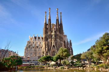 BARCELONA, SPAIN - FEB 2: View of the Sagrada Familia, a large Roman Catholic church in Barcelona, Spain, designed by Catalan architect Antoni Gaudí, on Febrary 2, 2013. Barcelona - obrazy, fototapety, plakaty