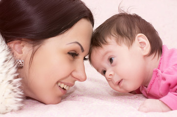 Young happy mother with baby