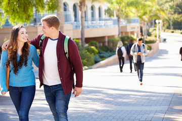 Fototapeta premium Student Couple Walking Outdoors On University Campus
