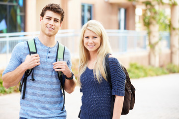 Male And Female University Students Outdoors On Campus