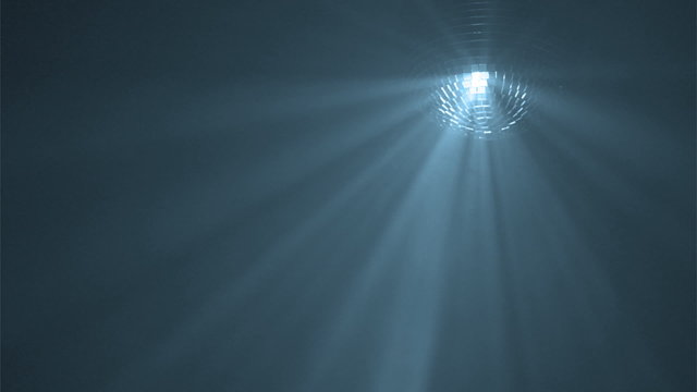 Disco ball with reflected moving blue rays