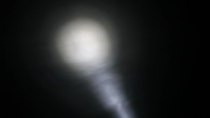 Moving spotlight in the hazy darkness, HD 1080p.