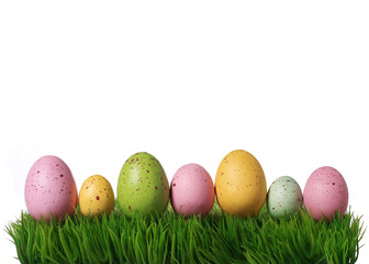 Colorful easter eggs on green grass isolated on white