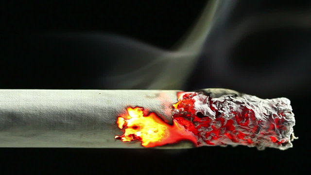 Closeup view of burning cigarette in time-lapse, HD 1080