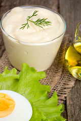 Mayonnaise in bowl with egg and lettuce
