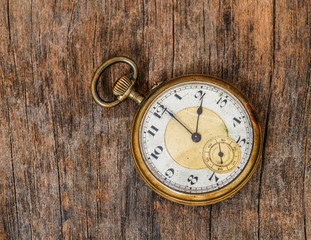 old clock vintage picture in wood background