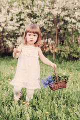 beautiful little girl with flowers