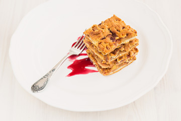 Slices of delicious fresh baked  apple cake on a wooden surface