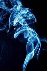 Blue smoke on black background
