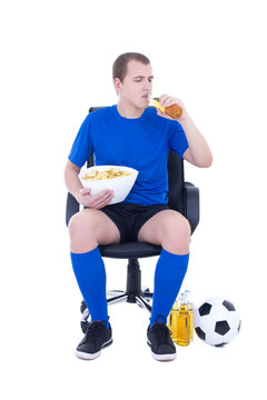man in blue uniform watching football and drinking beer isolated