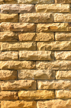 Sand stone brick wall surface, background of decorate