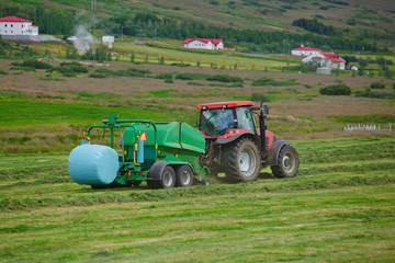 Tractor collecting haystack