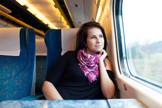 Young woman travelling by train