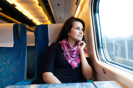 Young woman travelling by train