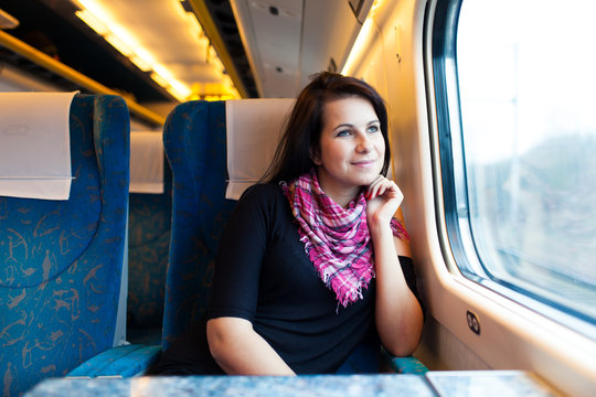 Young woman travelling by train