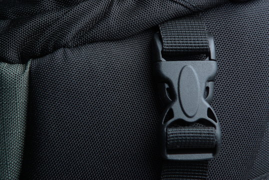 Black plastic buckle on backpack