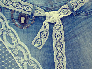 Denim background with lace and jewelry - 61782652