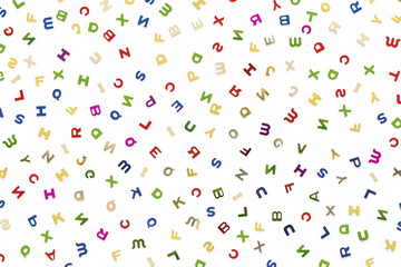 Many letters of various colors mixed