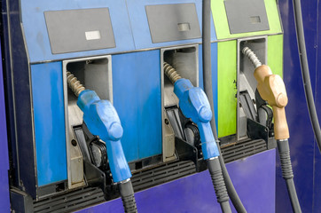 Four petrol pumps, close up