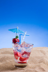 Fresh tropical cocktail on sunny beach