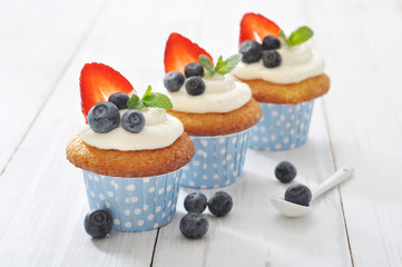 Cupcakes decorated with and fresh berries