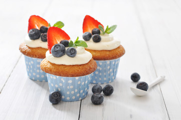 Cupcakes decorated with and fresh berries