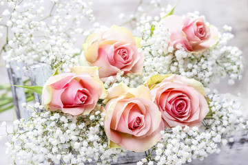 Beautiful pink roses and Gypsophila (Baby's-breath flowers). Wed