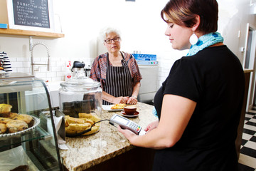 Customer paying at coffee shop