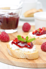 Toasted baguette with cream cheese, raspberry jam, raspberry