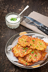 Fried potato pancakes on the old wooden background