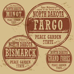Grunge rubber stamp set with names of North Dakota cities