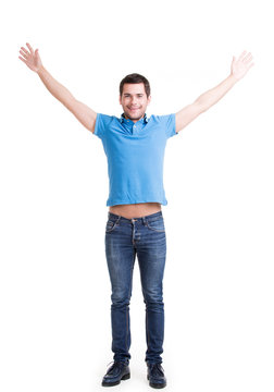 Young happy man in casuals with raised hands up.