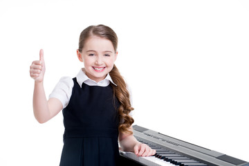 Happy schoolgirl with electric piano.