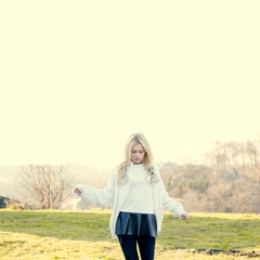 Fototapeta premium Portrait of a beautiful young girl outdoor in park