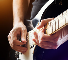Man playing guitar. Close-up view © efired