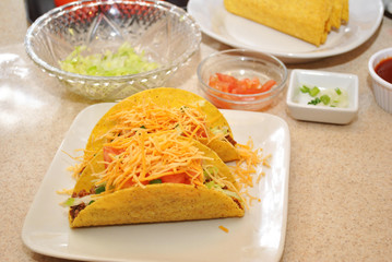 Two Cheesy Tacos with Fresh Ingredients