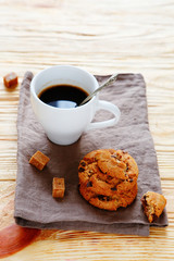 cup of coffee and cookies on a napkin