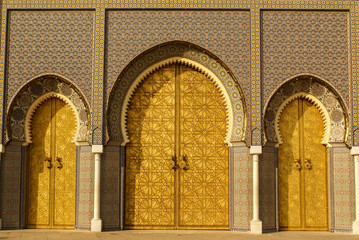 Naklejka premium Closeup of 3 Ornate Brass and Tile Doors to Royal Palace in Fez,