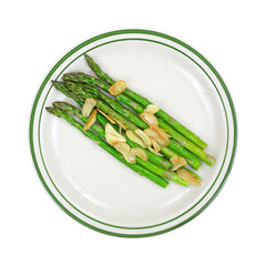 Cooked garlic and asparagus on plate