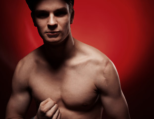 Fototapeta premium Muscular man portrait in the studio