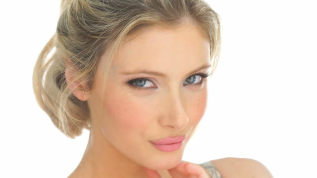 beauty blonde woman touching her face