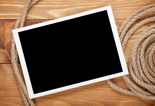 Blank photo frame with ship rope