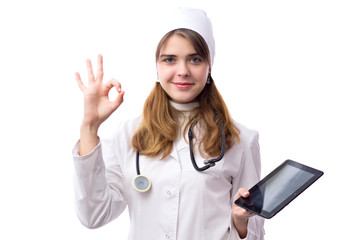 young doctor examines tablet with phonendoscope and repair it