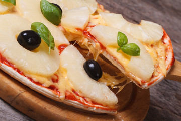 Slice of hot pizza with pineapple